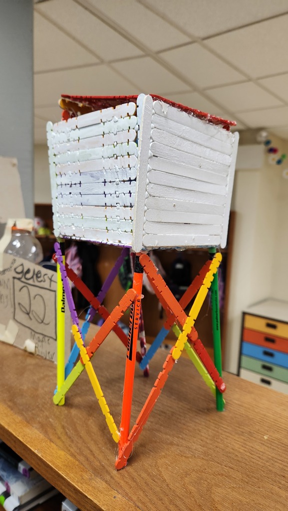 Tower built from popsicle sticks.