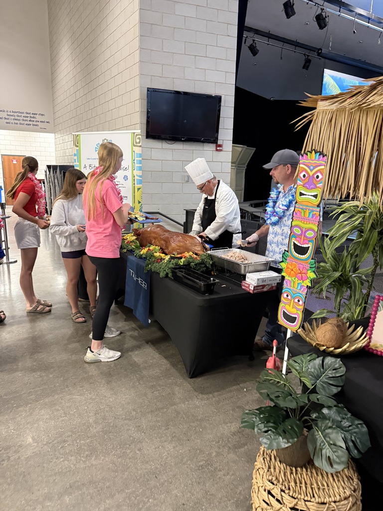 Chefs served the roasted pig to all students.