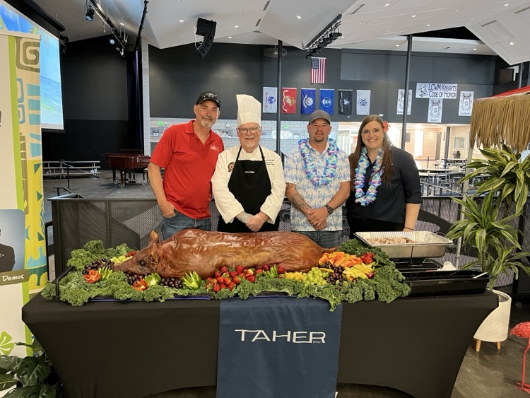 Taher with the pig and chef 