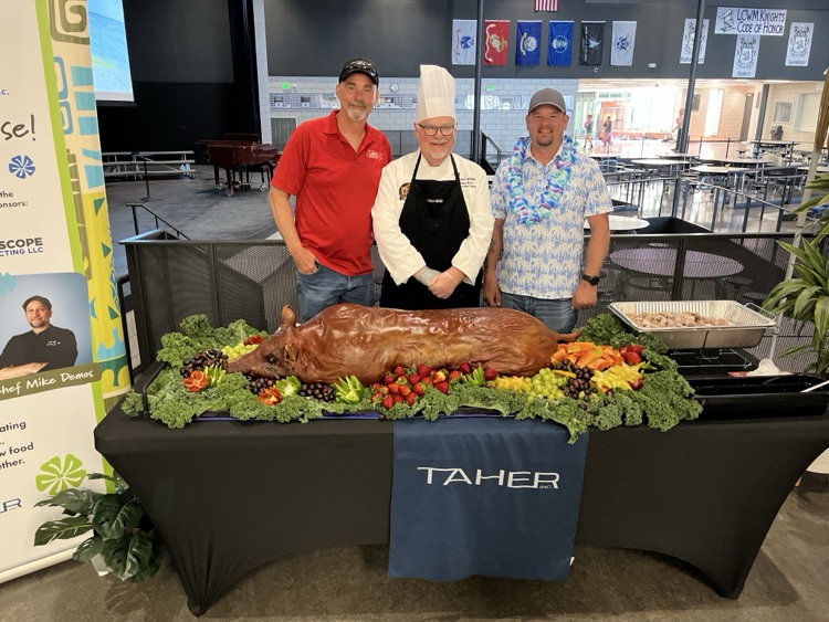 Taher with the pig and chef 