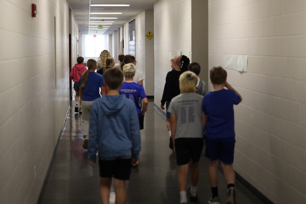 students walking down the hall.