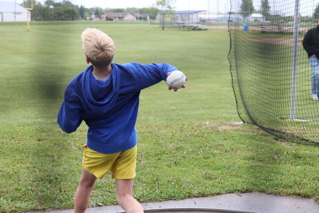 student doing the softball throw.