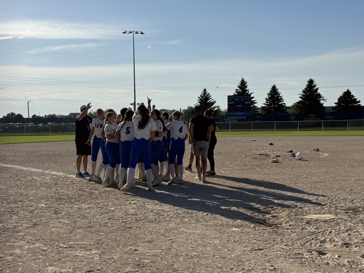 girls celebrating on the ball field  