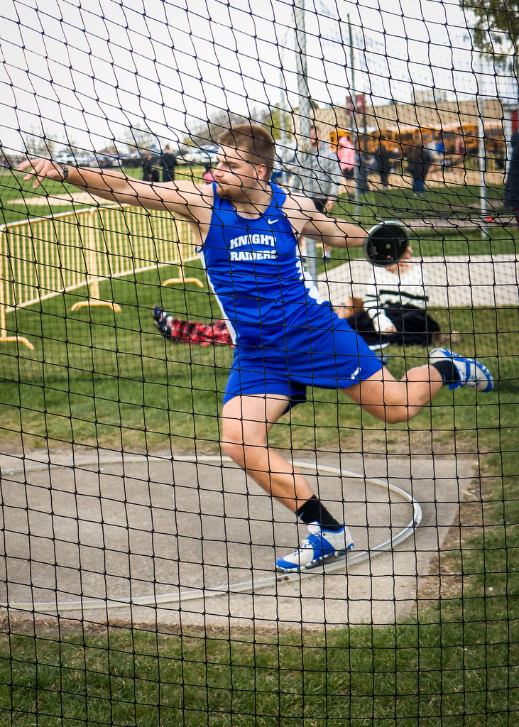 Discus thrower, throwing a disc. 