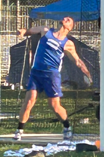 Drew Turgeon throwing discus.