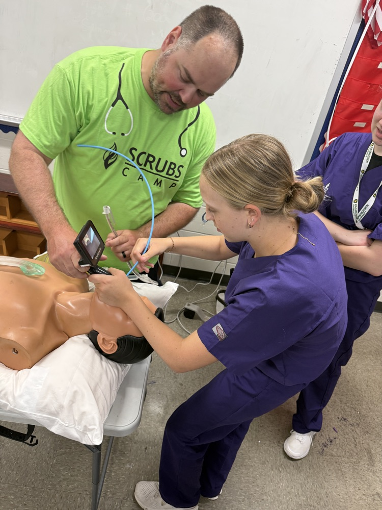 STUDENTS Practicing INTUBATING A PRACTICE DUMMY 