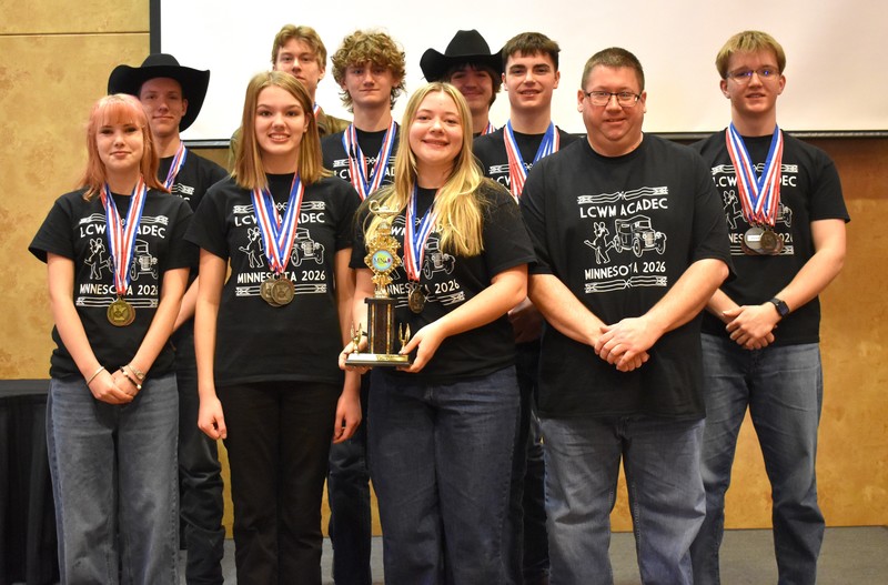 students posing and smiling at the camera.