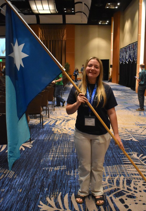 Student carrying MN state flag.