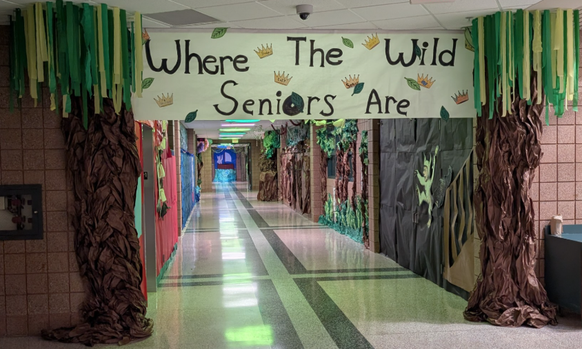 school hallway decorated with a large banner that reads Where the Wild Seniors Are