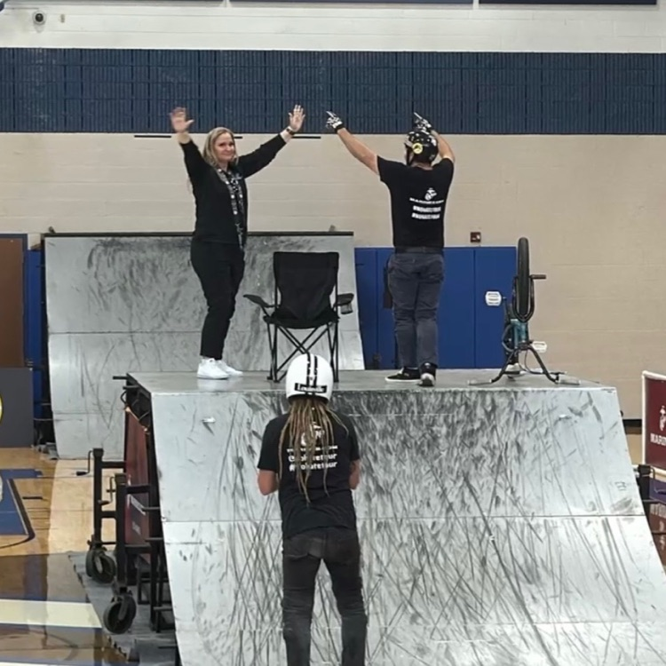 people doing bike stunts in a gym