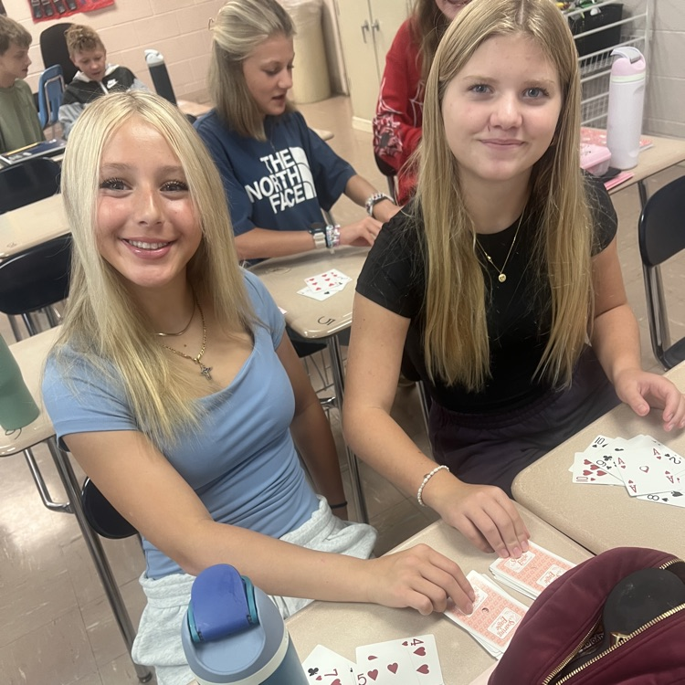 students using cards to do math