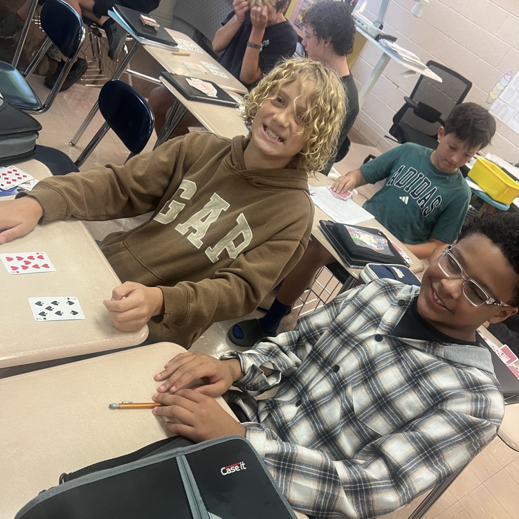 students using cards to do math