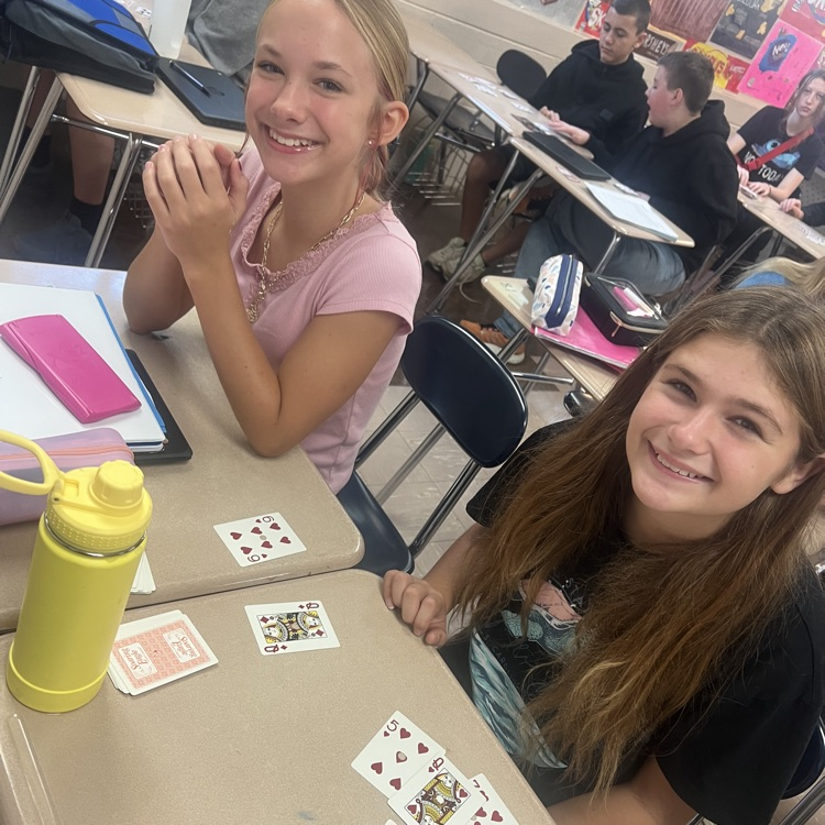 students using cards to do math