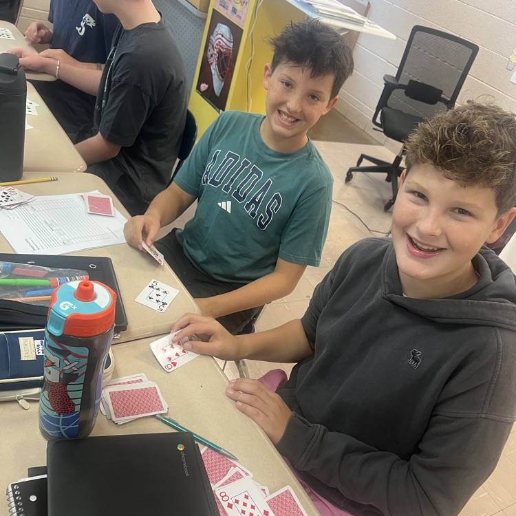 students using cards to do math