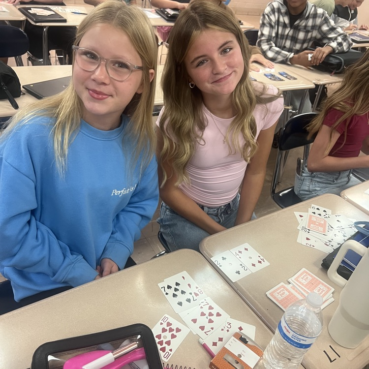 students using cards to do math