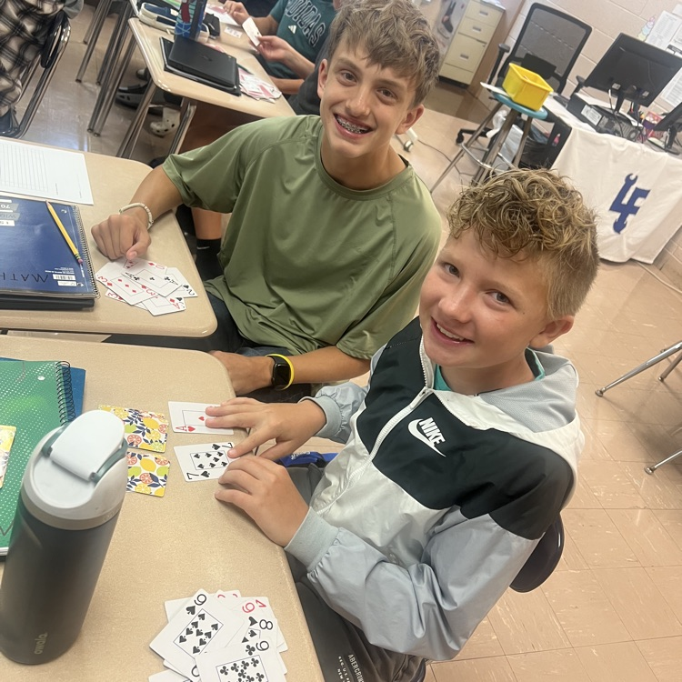 students using cards to do math
