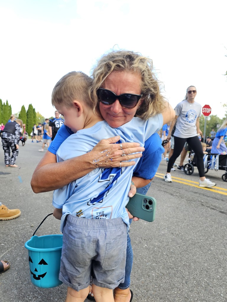 woman hugging boy