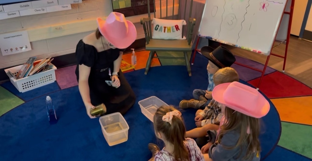 teacher and students in a classroom