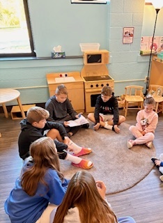middle schoolers reading to preschoolers