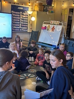 middle schoolers reading to preschoolers
