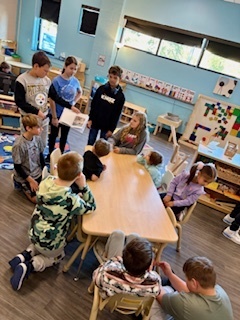 middle schoolers reading to preschoolers