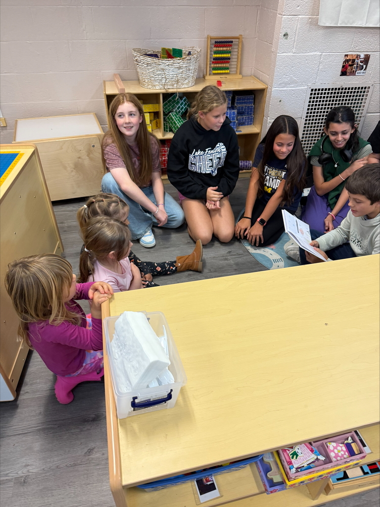 middle schoolers reading to preschoolers