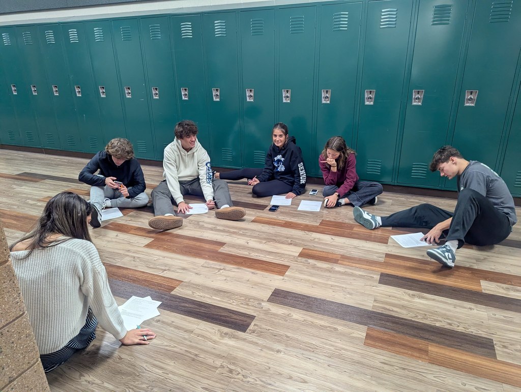 kids in a hallway studying