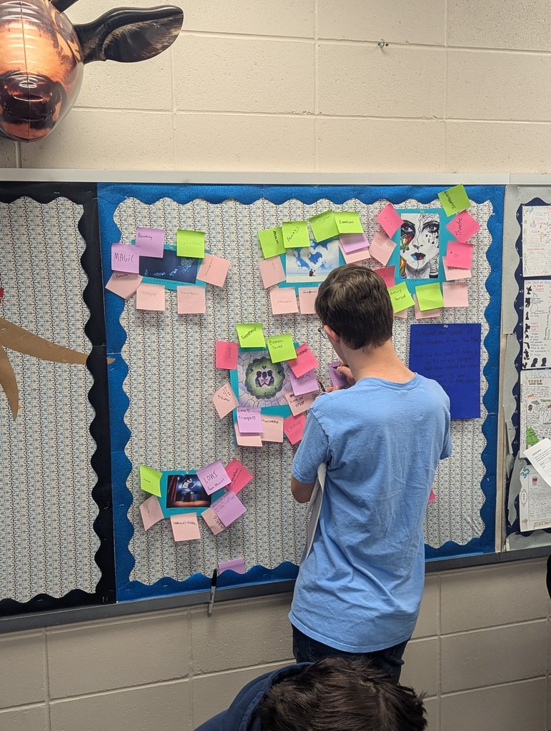 student at a bulletin board