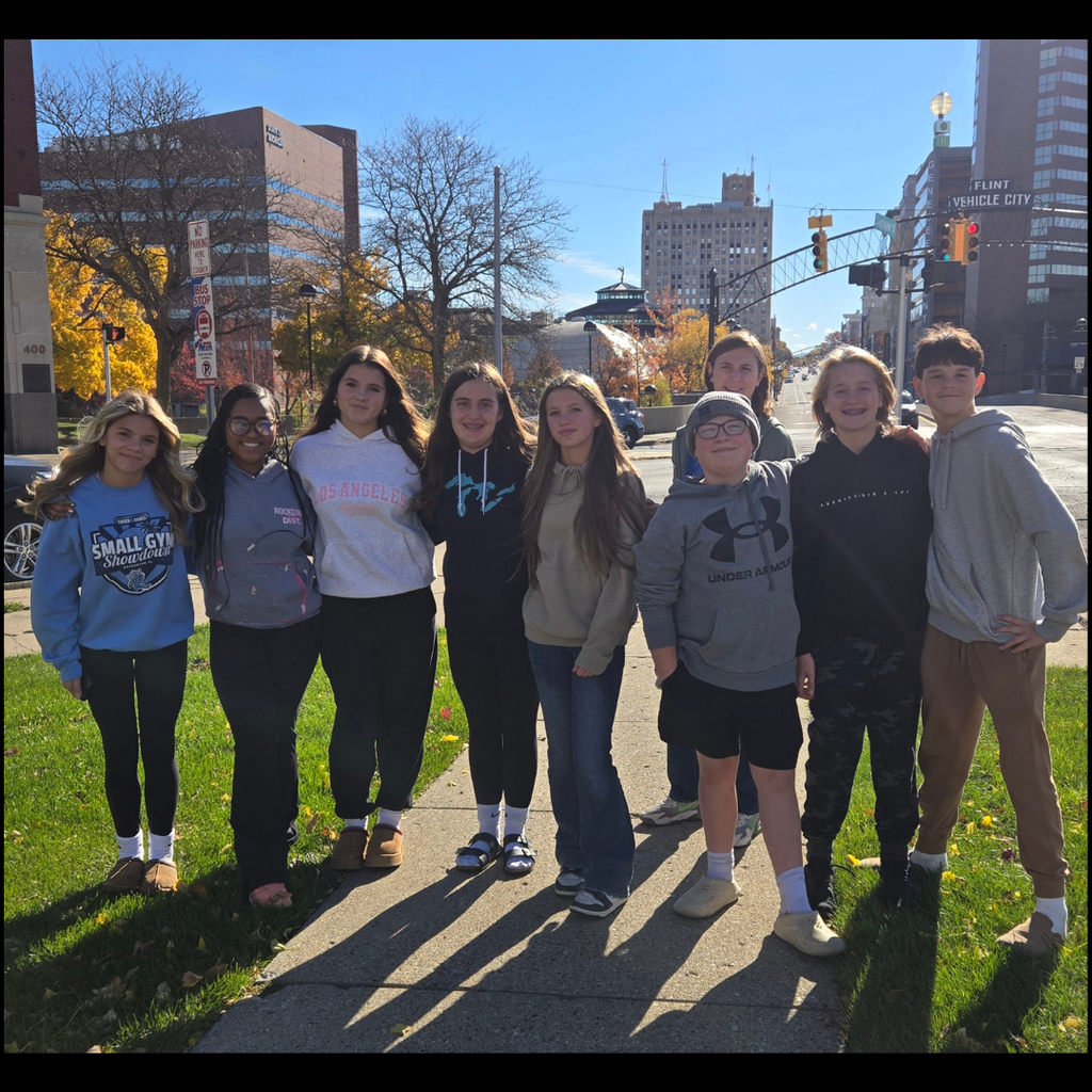 kids posing in a city