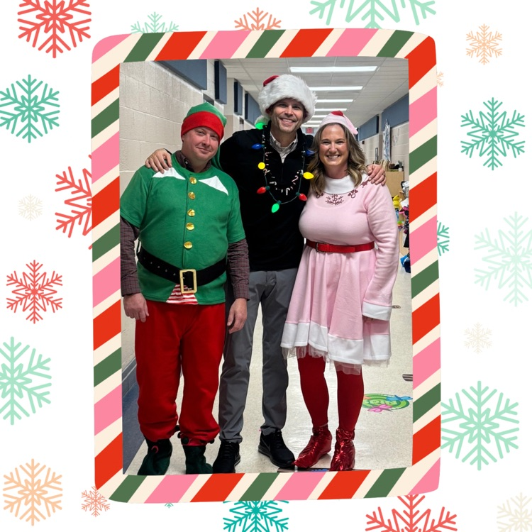 3 adults dressed in Christmas outfits