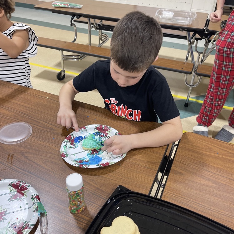 kid decorating cookies
