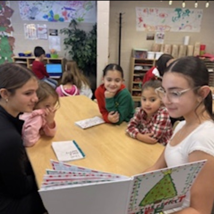 middle school students reading to preschool students