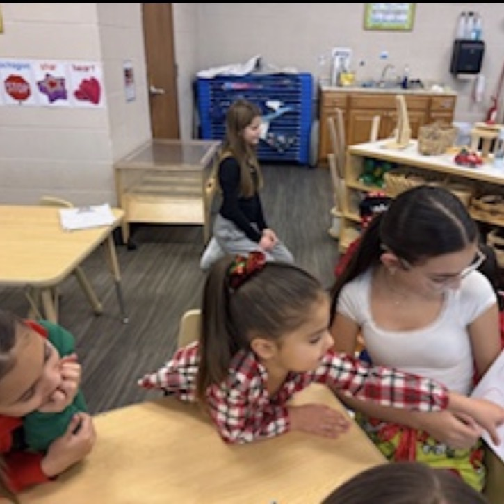 middle school students reading to preschool students