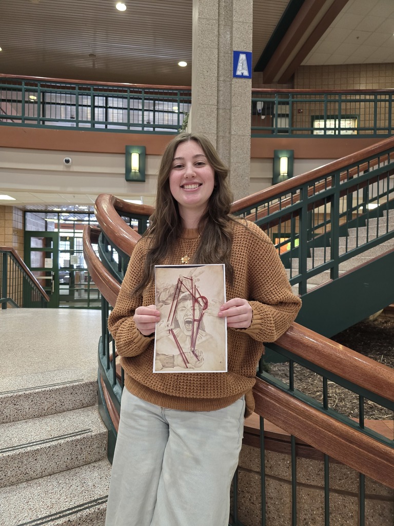 Girl holding art work