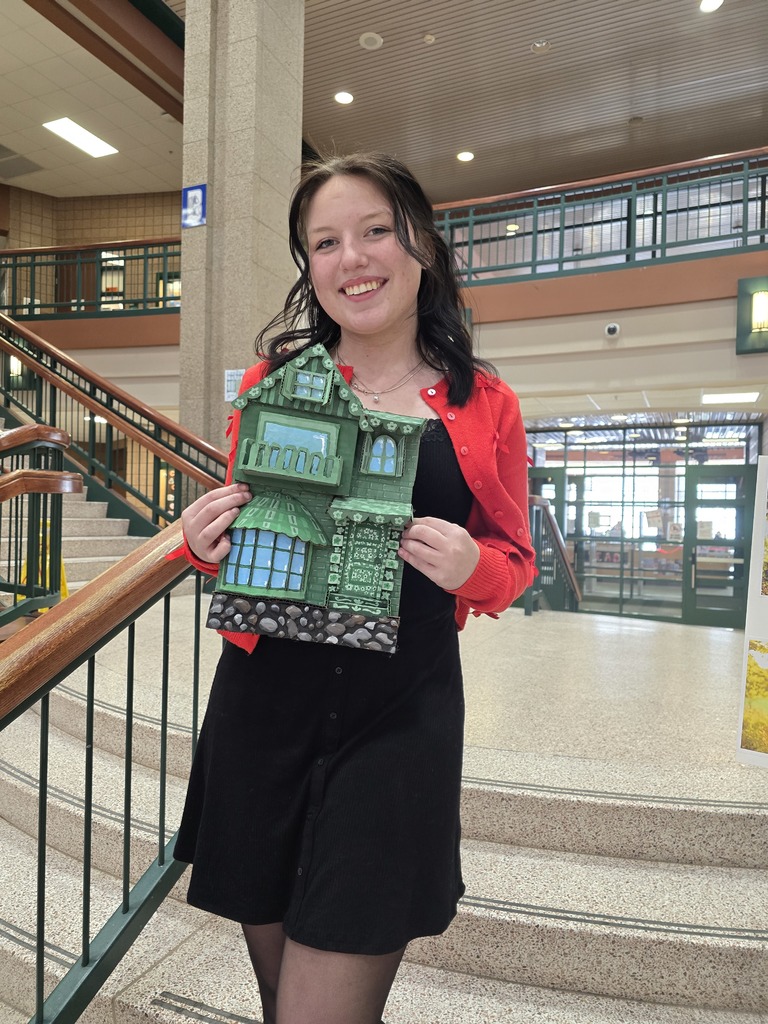 Girl holding art work