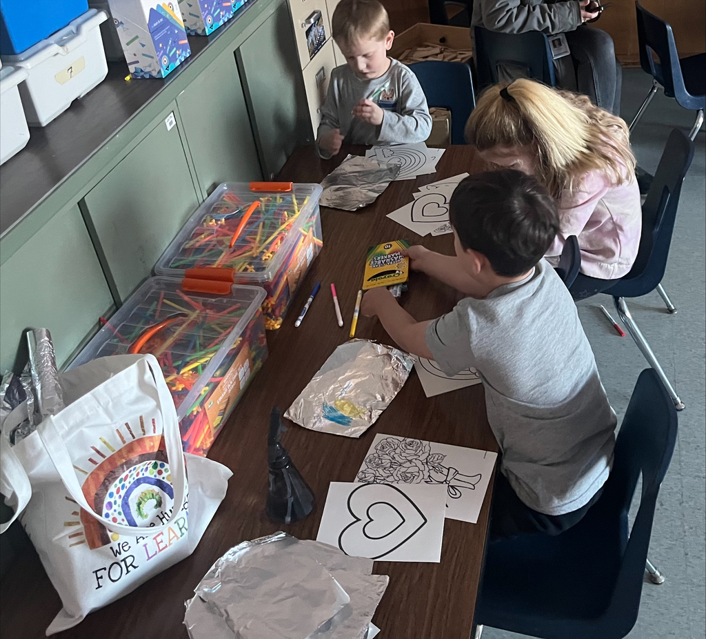 kids painting in a classroom