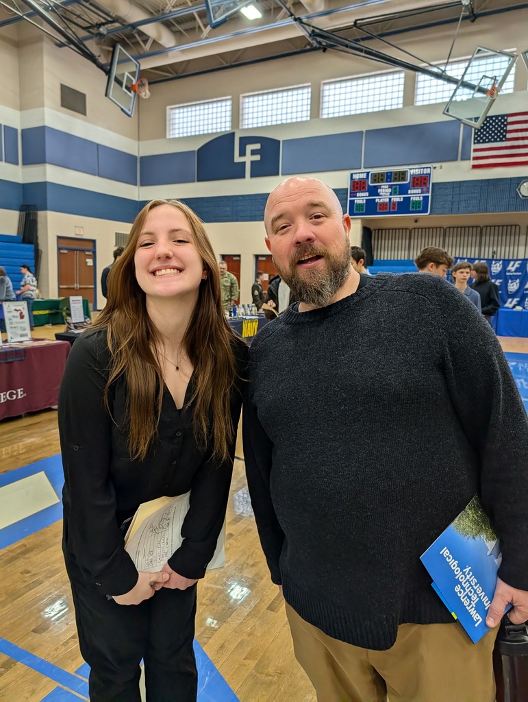 student and teacher posing at a job fair