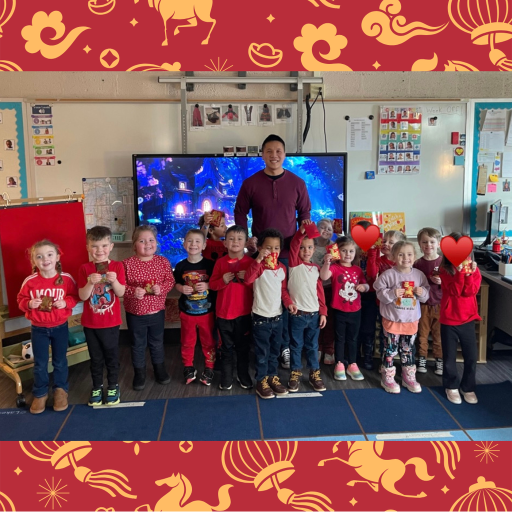 man posing with a group of preschool students in a classroom