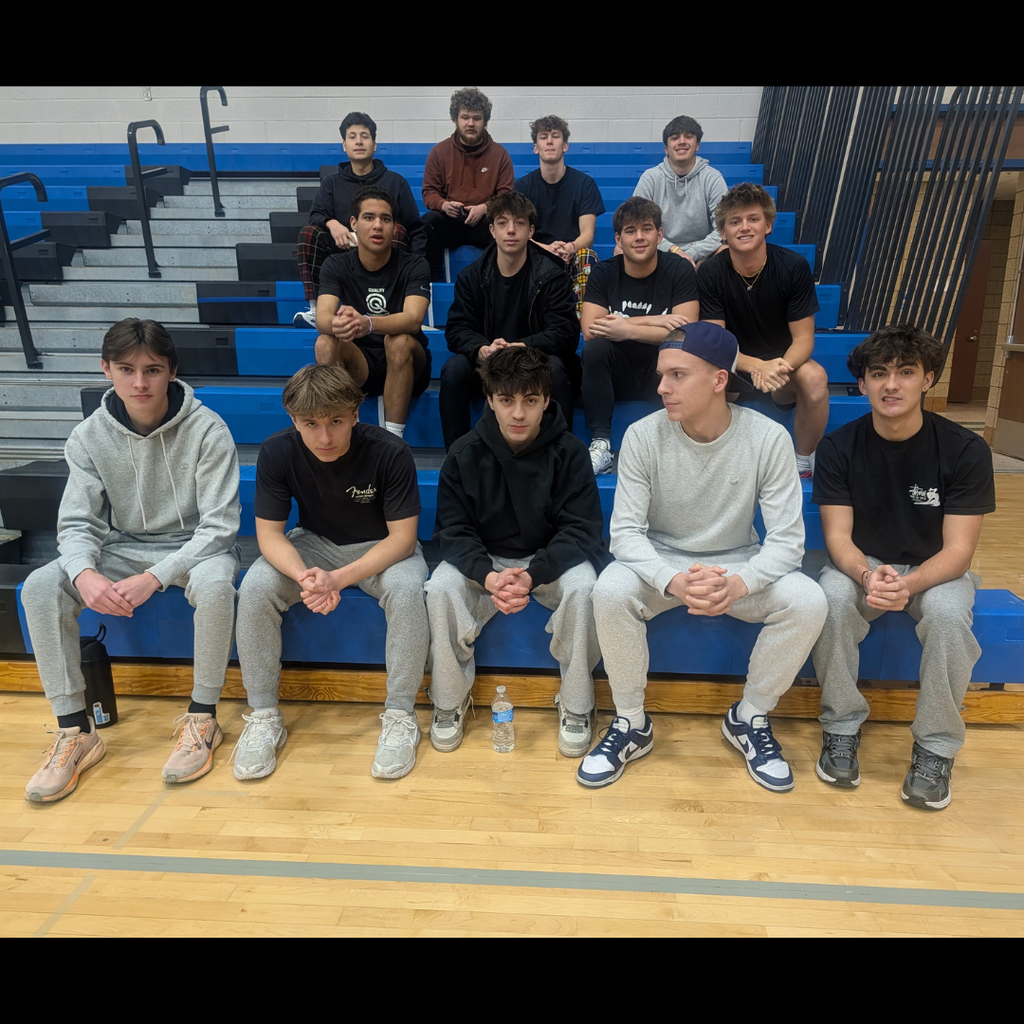 group of boys posing on bleachers