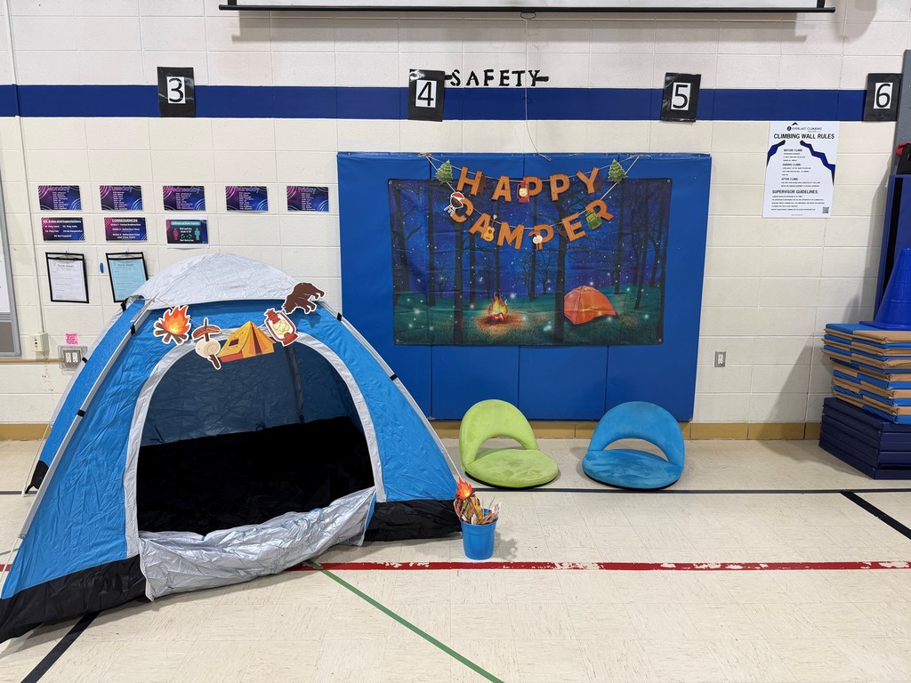 photo area with tent and happy camper sign