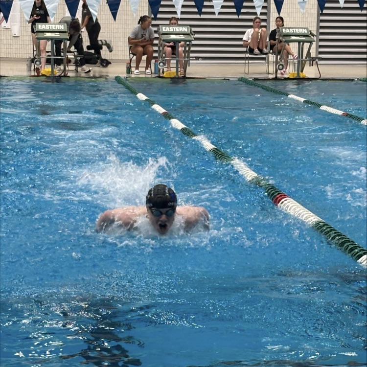 person swimming at a meet