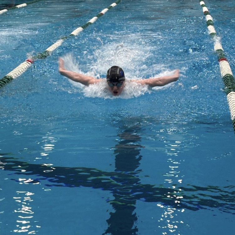 boy swimming at a meet