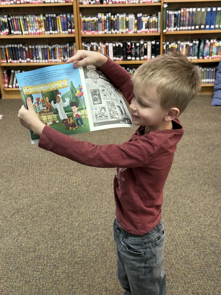 boy holding a book