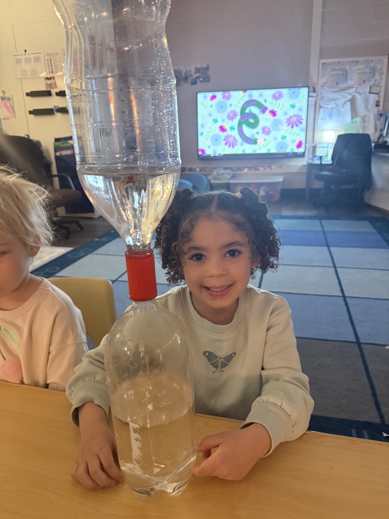 girl posing with clear bottles