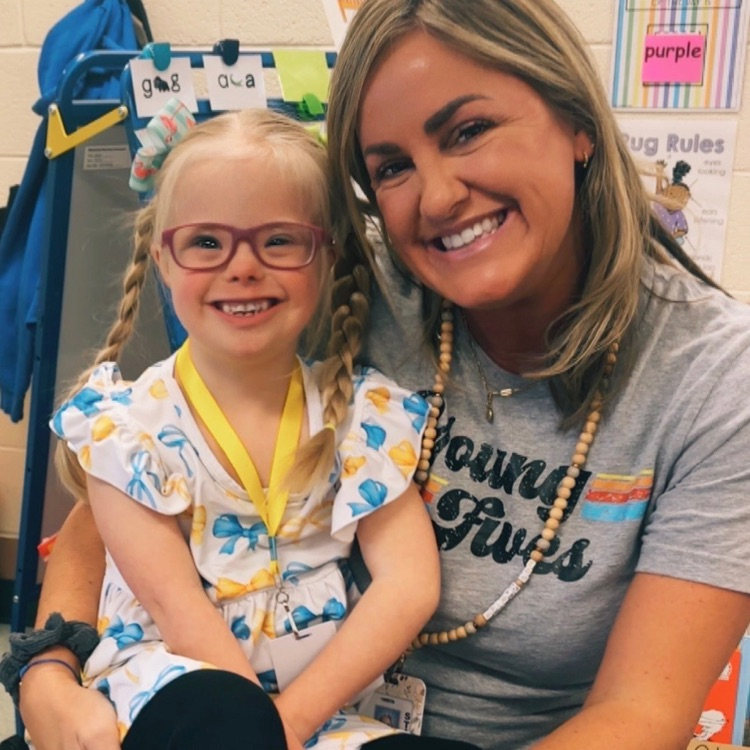 woman and girl smiling