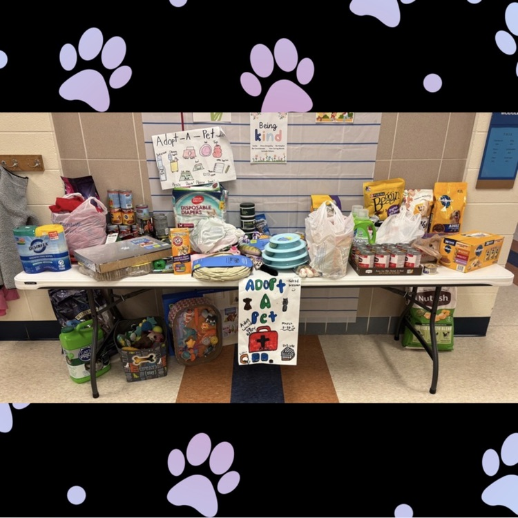 table full of donations for an animal shelter