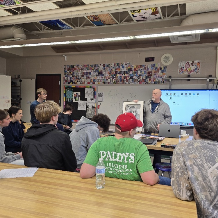 man doing a presentation for high school students