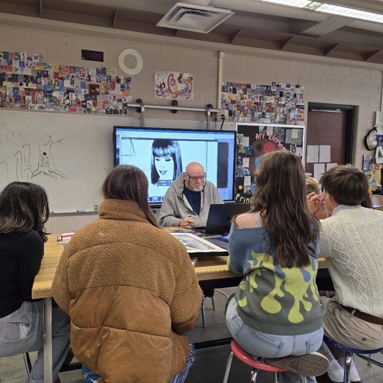 man doing a presentation for high school students