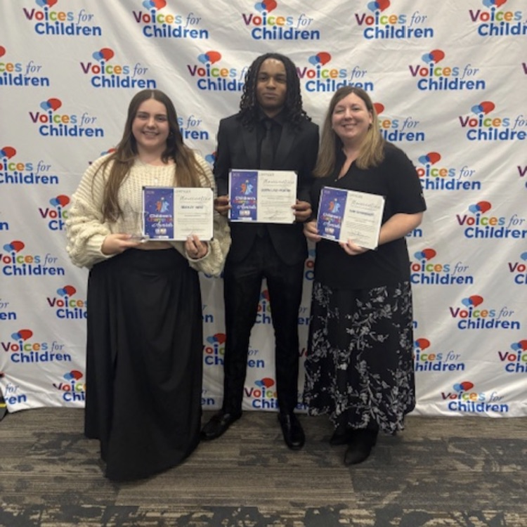 3 people posing with award certificates 