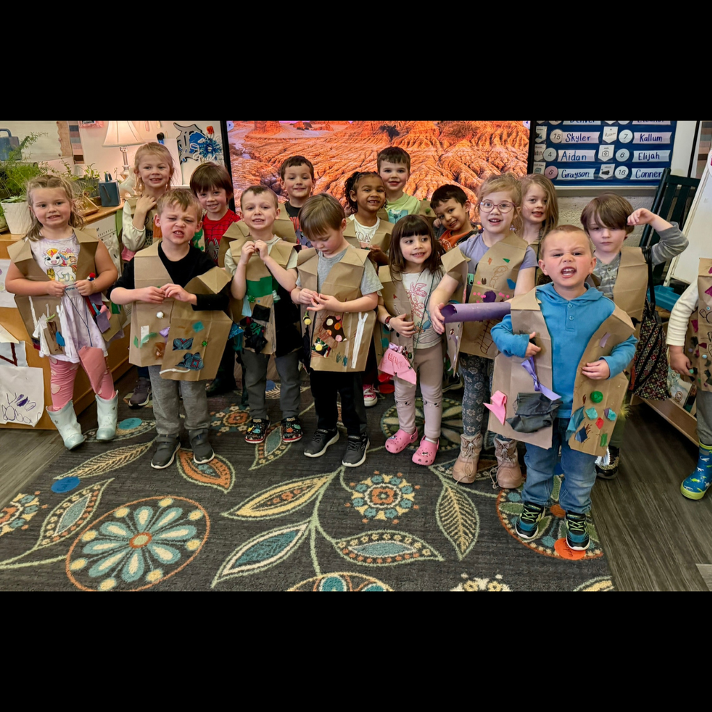 preschoolers posing in homemade vests